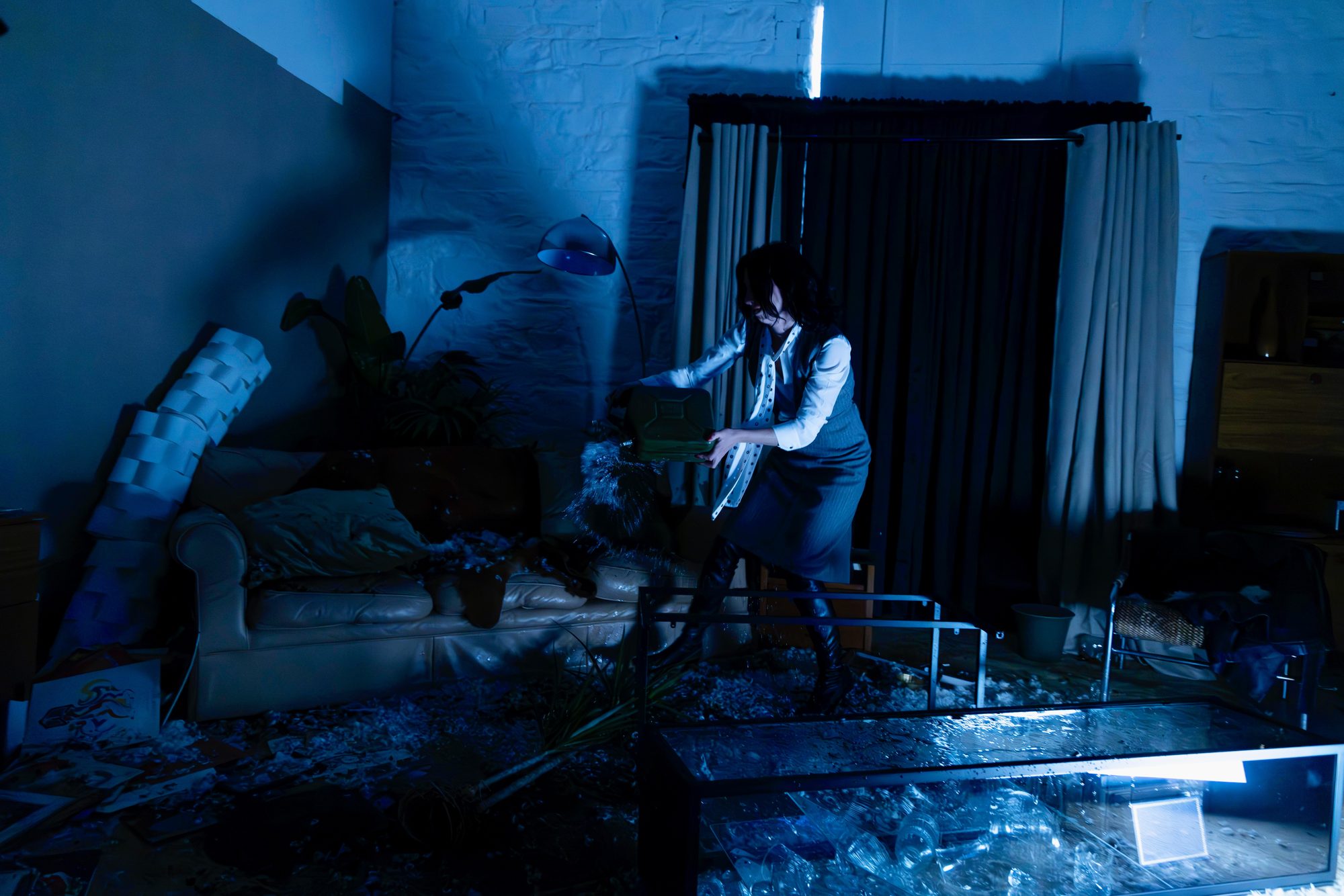 The wrecked set under blue light