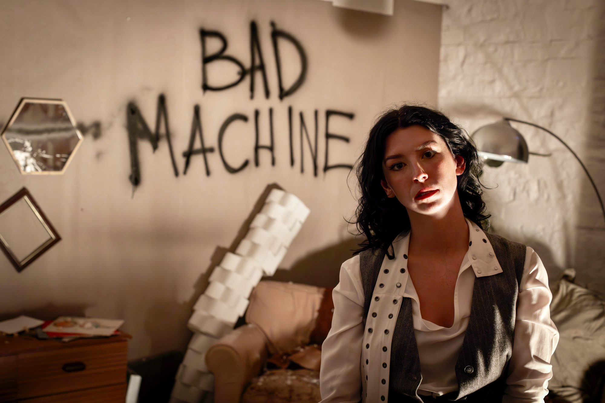 BAD MACHINE written across the apartment wall