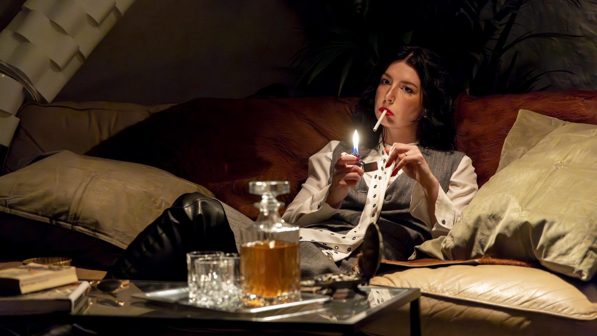Seated on the couch by candlelight