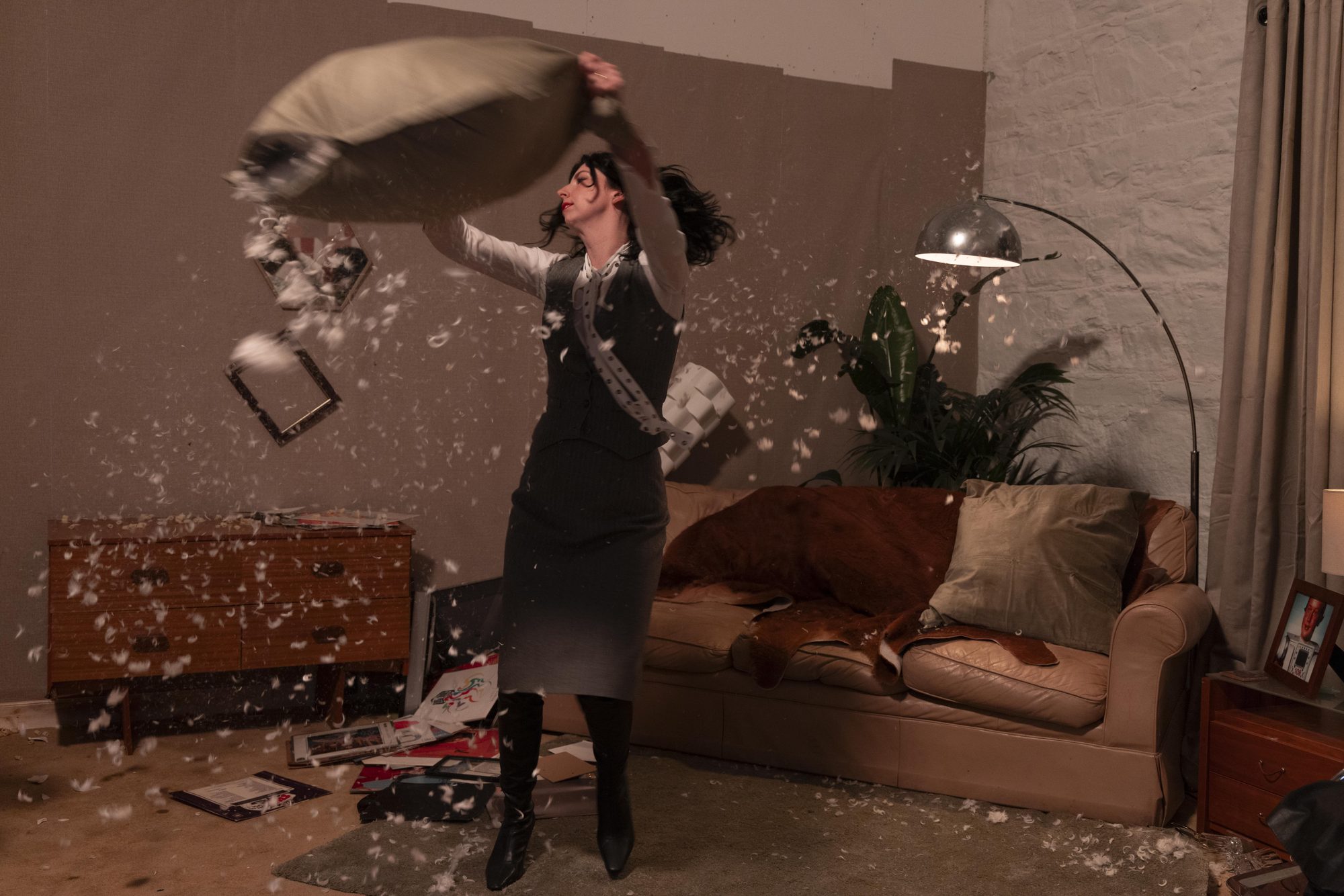 Pillow swung, feathers filling the room
