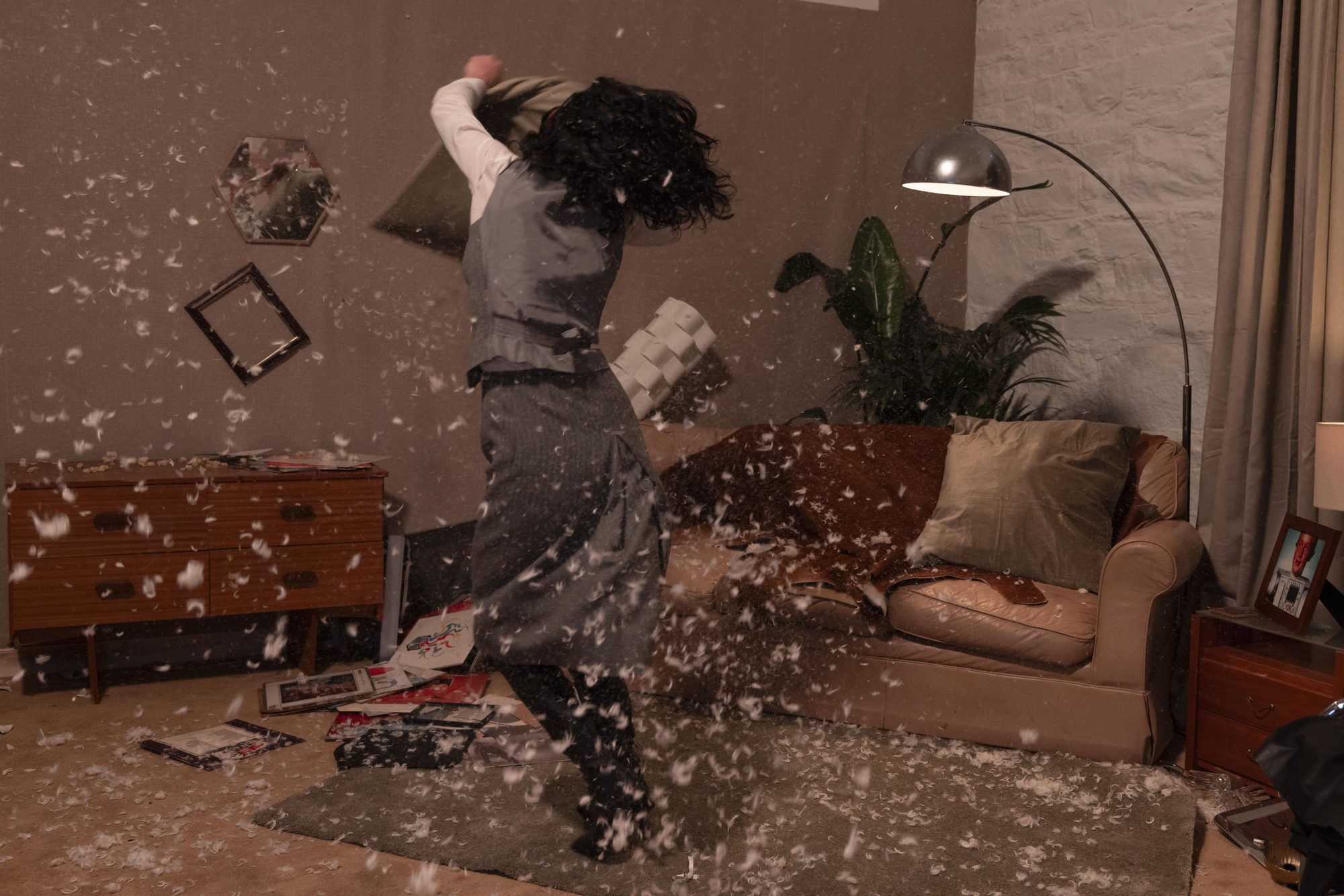 Feathers and debris across the apartment