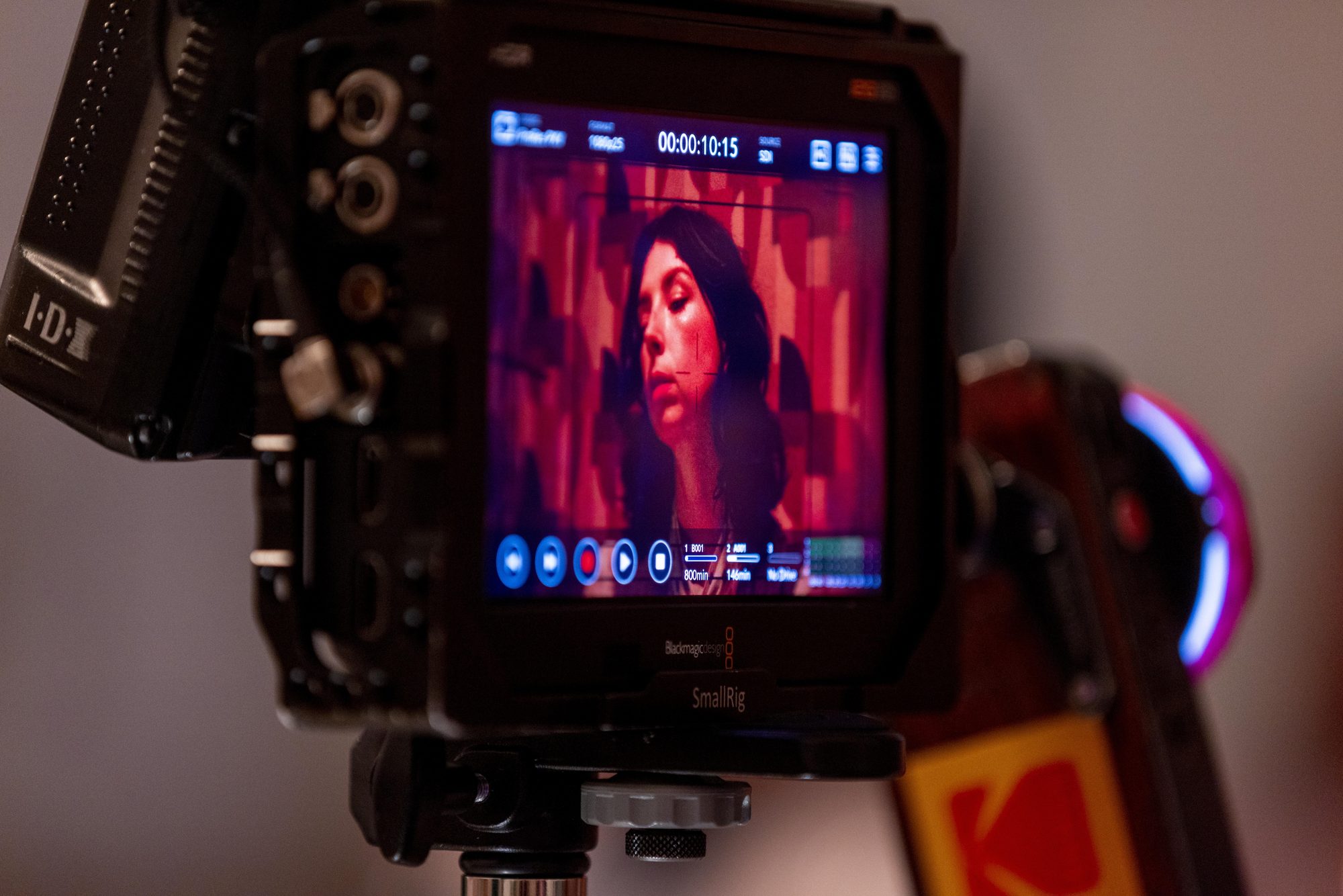 Monitor and Kodak-marked film camera on set