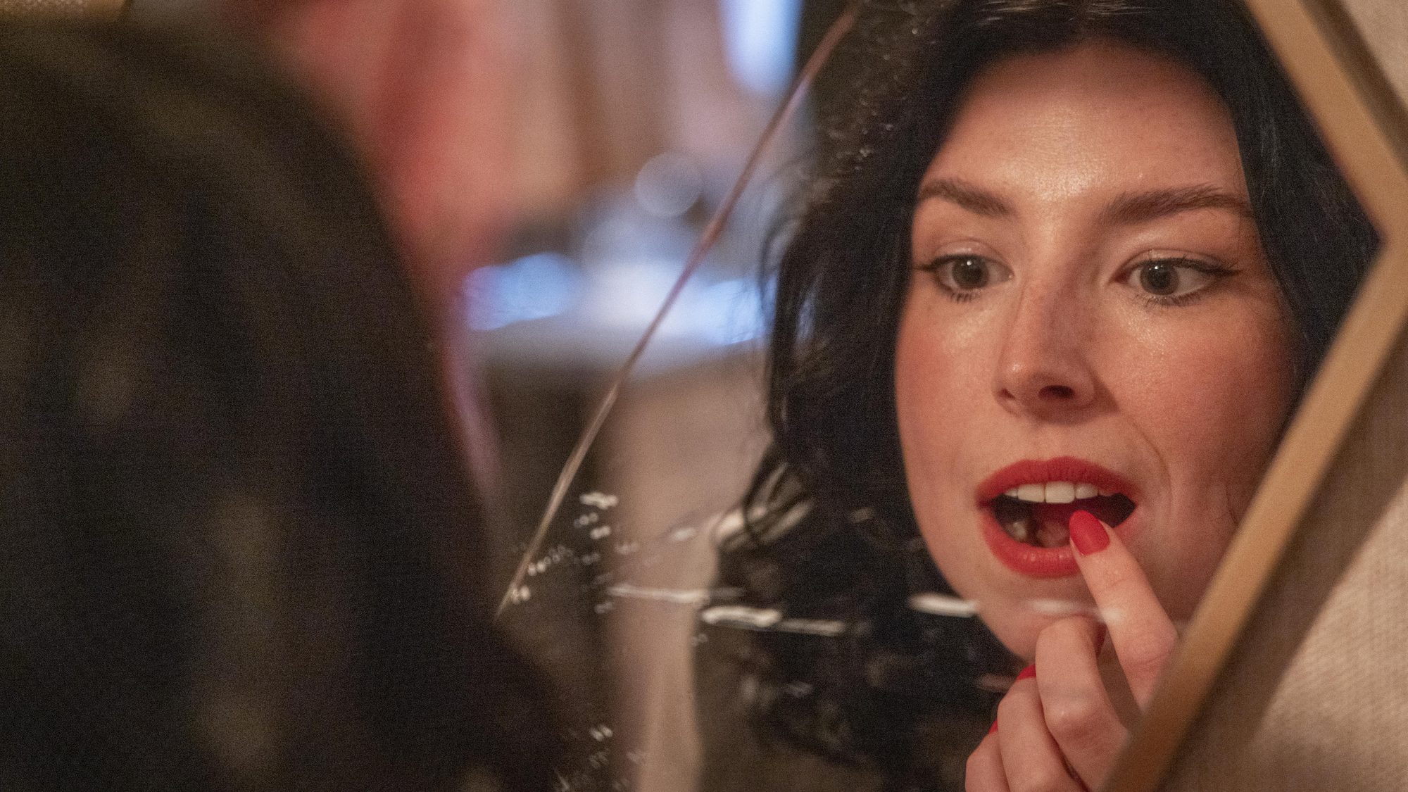 Close-up, applying lipstick