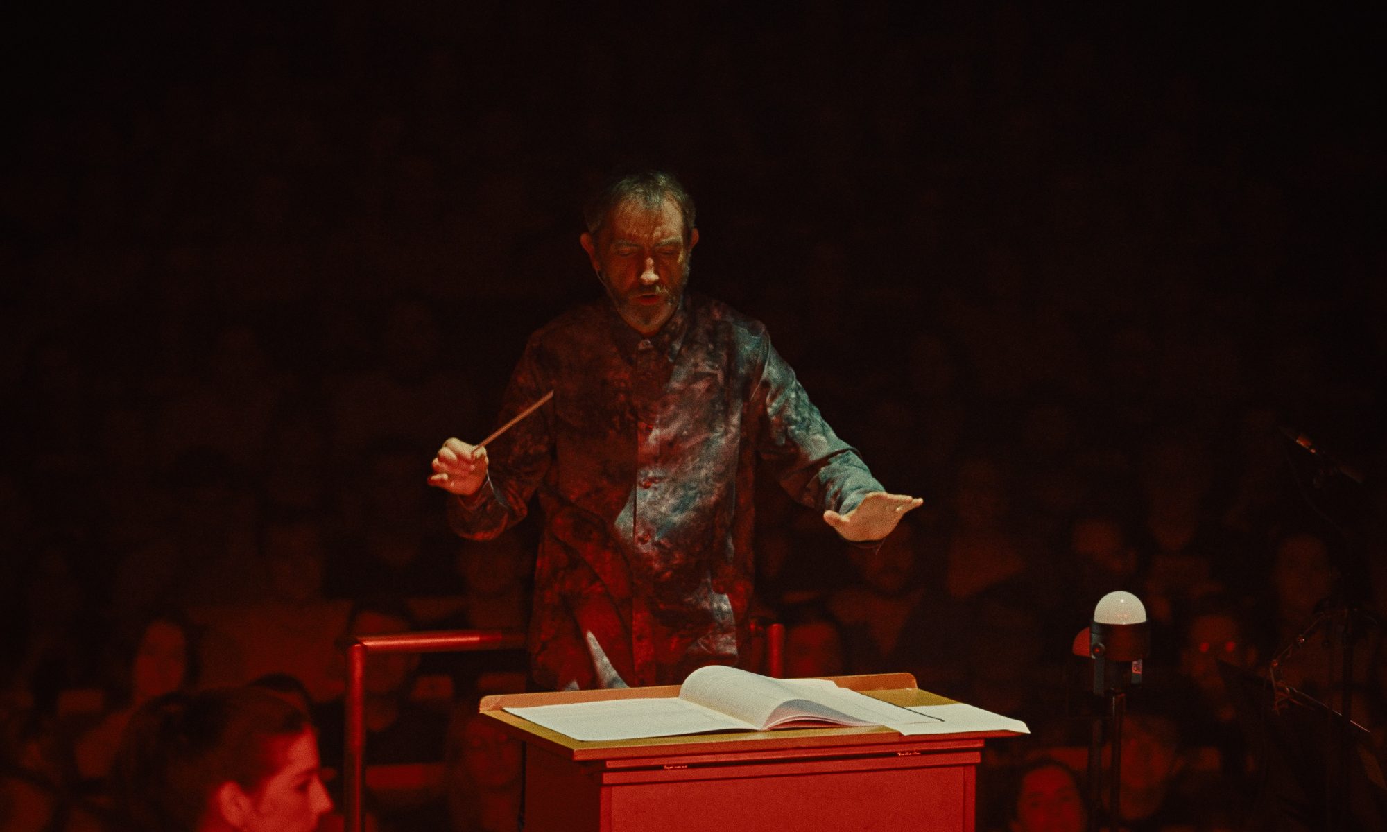 Conductor leading the National Symphony Orchestra